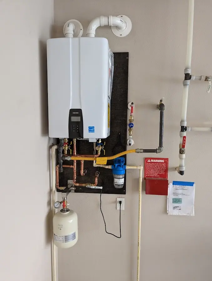 Professional plumber installing copper piping in a Sedro-Woolley home